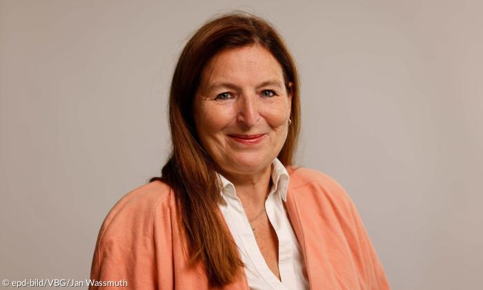 Eine Frau, sie lächelt