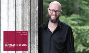Ein Mann im schwarzen Hemd