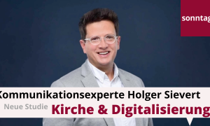 Ein Mann im grauen Anzug mit Brille